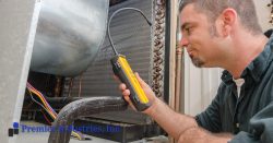 Man fixing an evaporative cooler