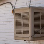 An evaporative swamp cooler on a wall