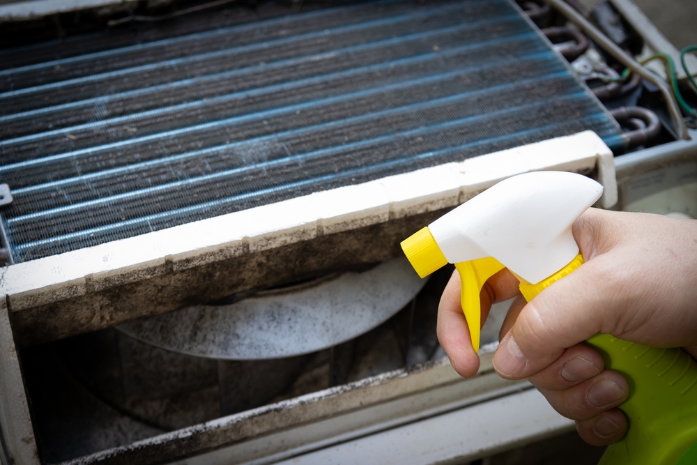 Applying spray to a swamp cooler as maintenance