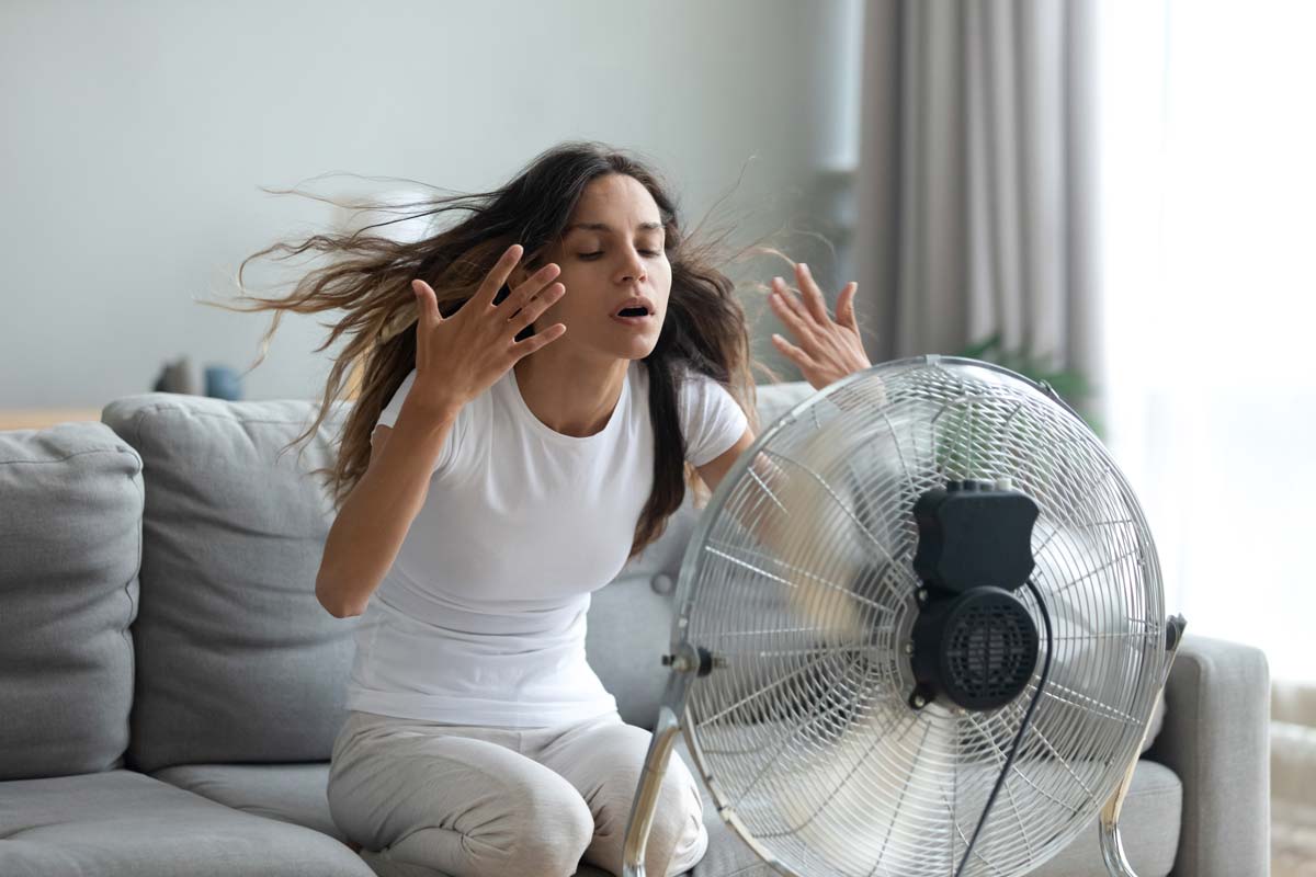 Woman in front of a working fan
